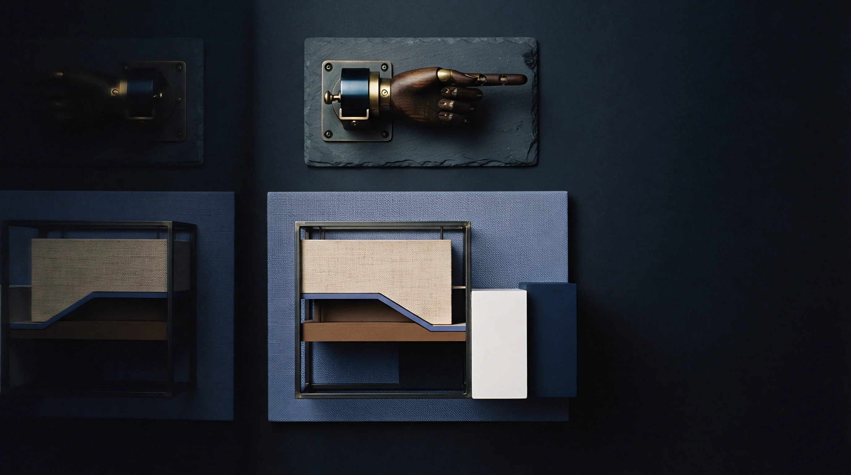 Articulated wooden pointing hand and modular block assemblies mounted on dark slate and textured panels organize industrial production workflow layouts.