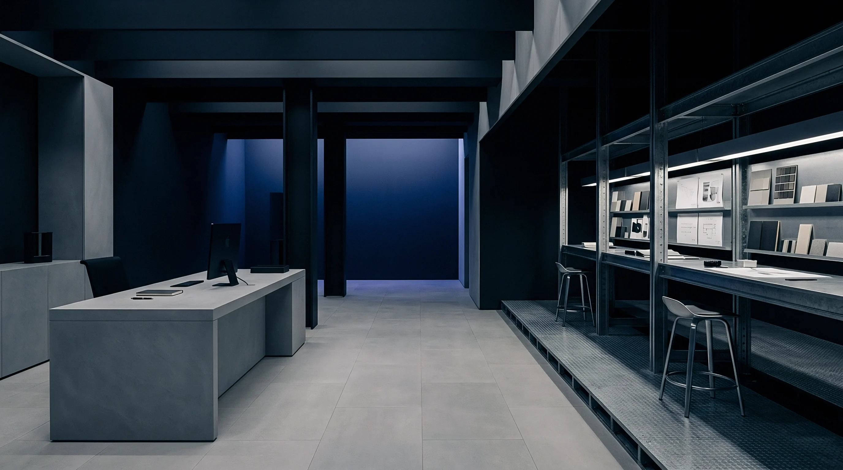 Minimalist design studio interiors feature expansive concrete workstations and modular metal storage racks displaying varied material swatches and technical manufacturing diagrams for industrial product development.